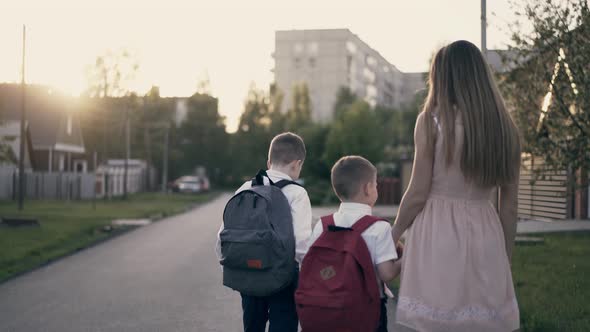 Tracking Slow Motion Young Mother Goes with the School Children They Tell Her About Successes