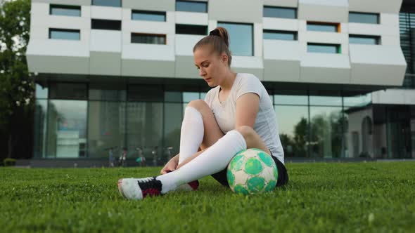 Portrait of Woman Football Player in the Park