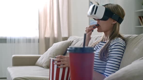 Woman Watching Movie in VR Goggles