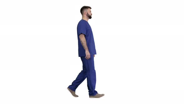 Serious Male Surgeon with a Beard Walking on White Background