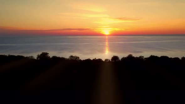 Landscape of the Sunset Over the Ocean Next to the Precipice Filmed By Drone