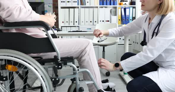 Female Patient in Wheelchair Visits Doctor and is Diagnosed with Leg Numbness