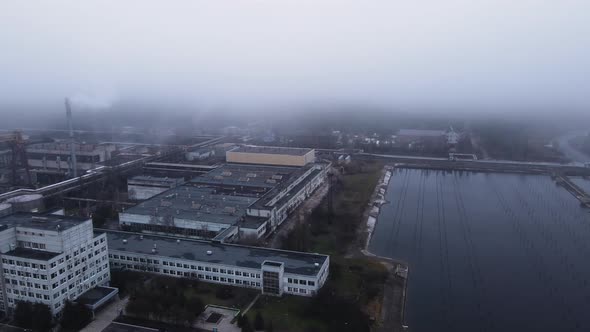 Aerial View From a Drone to a Thermal Power Plant in Cloudy Foggy Weather