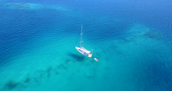 Beautiful drone abstract view of a white paradise beach and aqua turquoise water background 