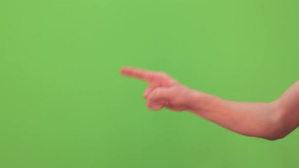 Closeup View of Male Hand Pointing at Something with Index Finger Insistently.