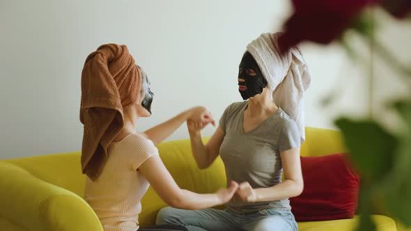 Portrait of Pretty Joyful Girl Friends Doing Beauty Treatments at Home