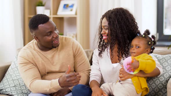 Happy African Family with Baby Daughter at Home