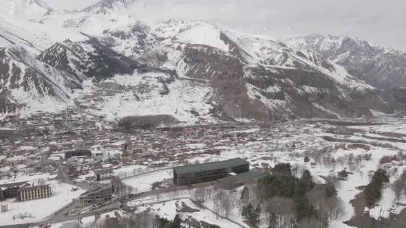 Aerial view of beautiful snowy mountains in Stepantsminda, Georgia