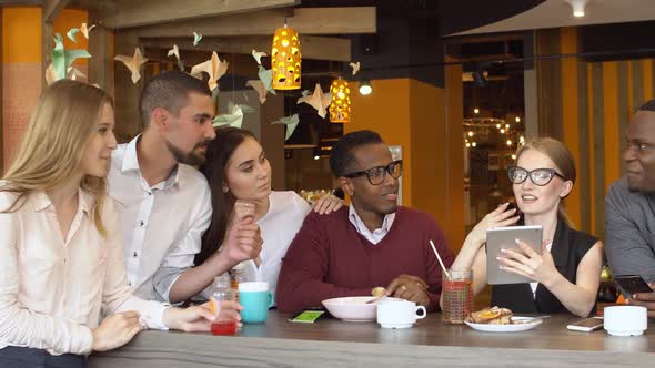 Happy Multiracial Diverse Students Having Fun Enjoy Communication at Group Meeting in Coffee Shop.