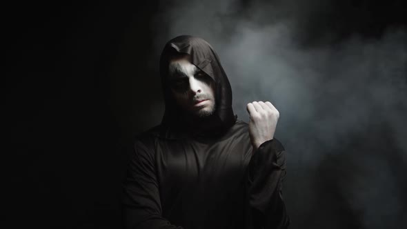 Man Dressed Up Like Grim Reaper for Halloween Party