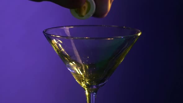 Barman Pouring Liquid, Vodka From Shaker and Gayser Bar, Close Up, Slow Motion, on Blue