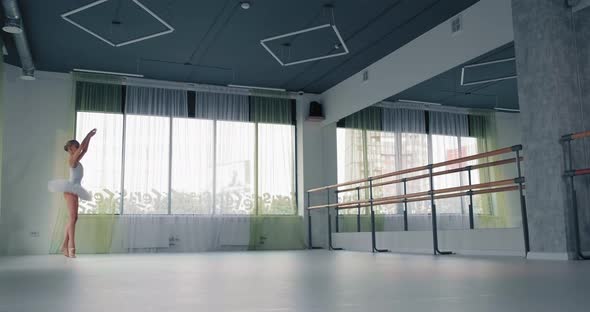 Talented Girl in Tutu Dances Ballet in Spacious Studio