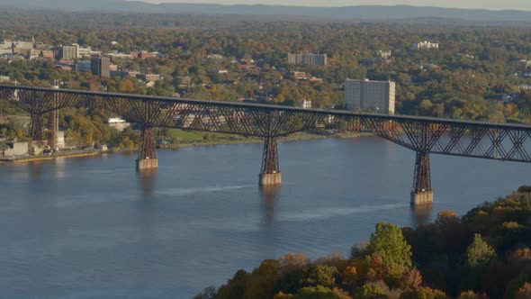 Aerial of walkway over Hudson river and town at a distance