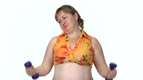 Funny Fat Woman Training with Dumbbells