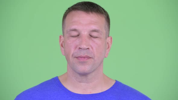 Face of Macho Mature Man Relaxing with Eyes Closed