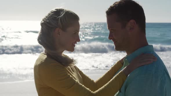 Couple in love enjoying free time on the beach together