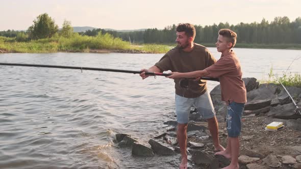 Father Teaching Son Fishing