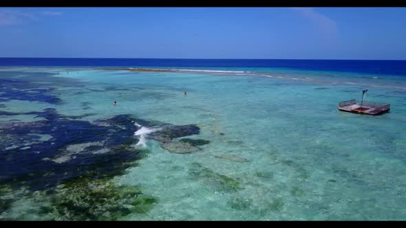 Aerial drone panorama of marine shore beach holiday by blue lagoon and white sand background of a da