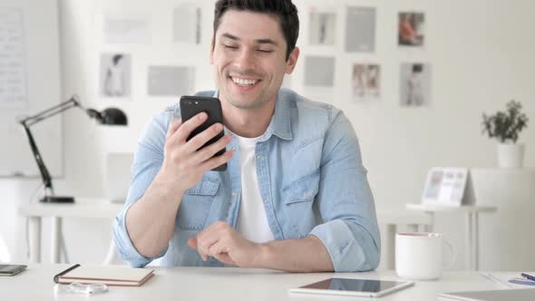 Online Video Chat By Casual Young Man Via Smartphone