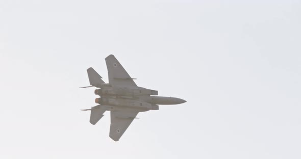 F-15 fighter jet maneuvering during an airshow