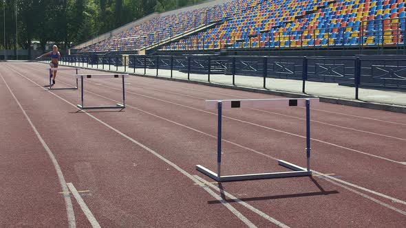 Stubborn girl spending days at stadium, training before hurdle race competition