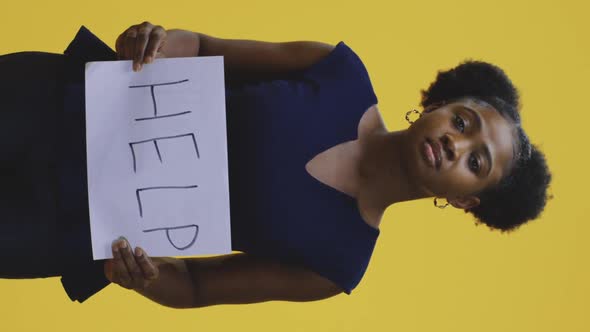 Woman Holding Help Sign