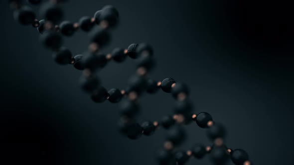 Abstract animation of blurred grey DNA strand rotating on dark grey background