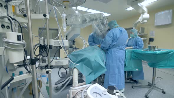 A Group of Surgeons Is Performing an Operation in a Medical Unit