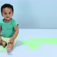 Baby boy sitting on world map on floor - VideoHive Item for Sale