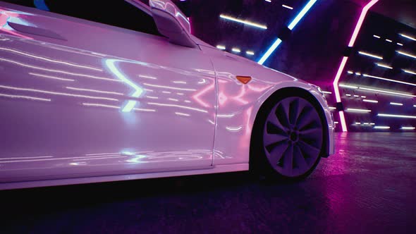 A White Car Drives Fast Through a Neon Tunnel