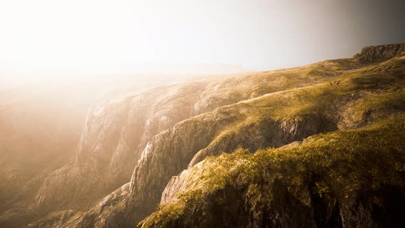 Dry Yellow Grass on the Rocky Mountain with Heavy Fog