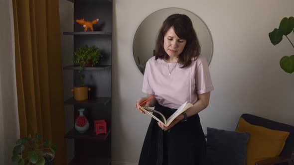 Cheerful female artist in home studio