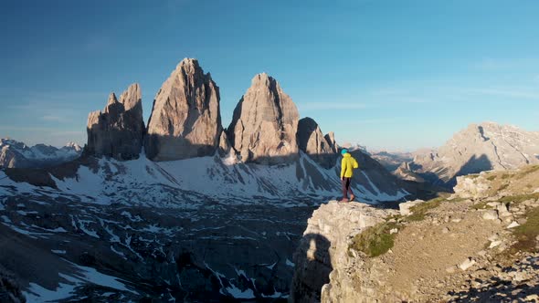 Aerial Man Hiker Walk In Front of Cadini Mountain in Dolomites Italy