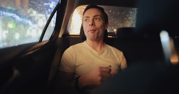 Man Chewing Gum in a Car