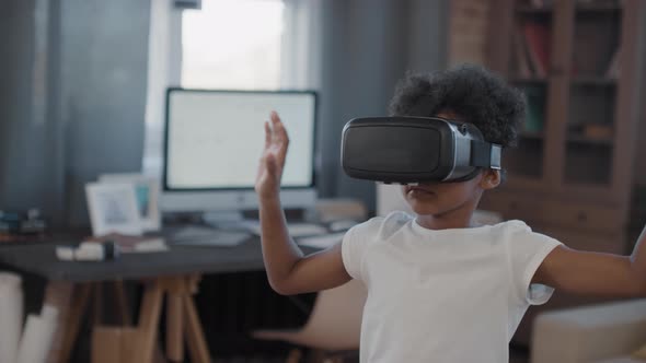 Mixed-Race Boy In VR Headset