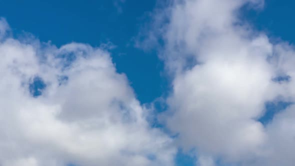 Time lapse of moving clouds in blue sky