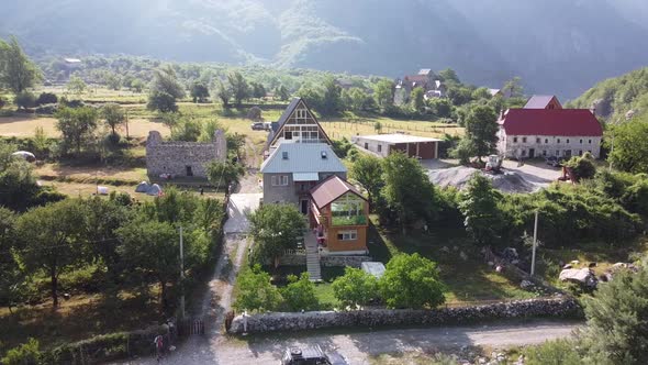 Flying Near Old Wooden Church and Trees in Thethi Valley Albania