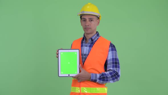 Stressed Multi Ethnic Man Construction Worker Showing Digital Tablet