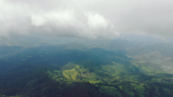 Aerial Drone View Mountains Covered with Green Grass and Green Trees. View of the Mountain Tops