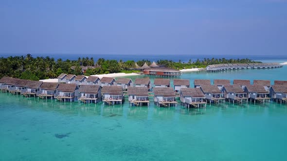 Aerial travel of coastline beach voyage by blue lagoon and sand background