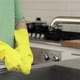 Woman finishing washing up and removing rubber gloves - VideoHive Item for Sale
