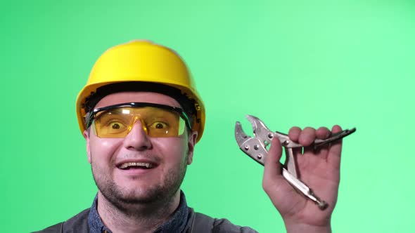 Young Male Electrician Engineer with Tool in Hands on Chromakey Background