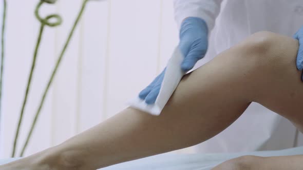 Beautician Making Wax Depilation in a Beauty Spa