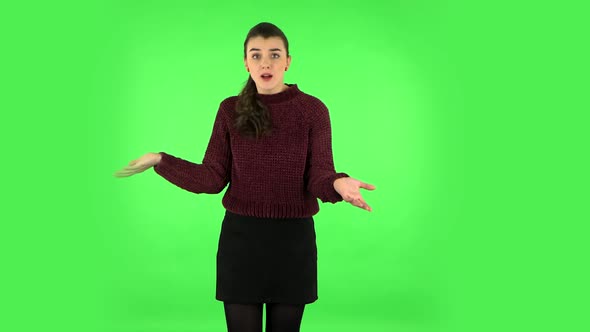 Displeased Woman Indignantly Talking To Someone, Looking at the Camera. Green Screen