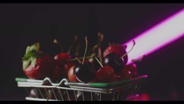 Red Fresh Strawberries and Cherries in a Little Trolley From a Super Layout