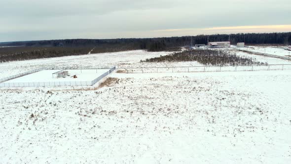 A Drone Flies Over a Snowcovered Area in the Northern Part of the Country in an Industrial Area