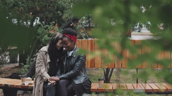 Happy Lesbian Couple Being Affectionate in Park