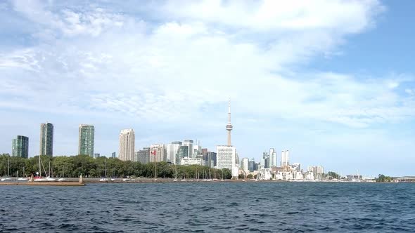Toronto coastal view with boats on sunny day. CN Tower. Time lapse