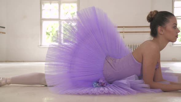 Ballerina resting in twine position