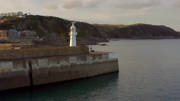 A Lighthouse on the Breakwater of Mevagissey in Cornwall UK